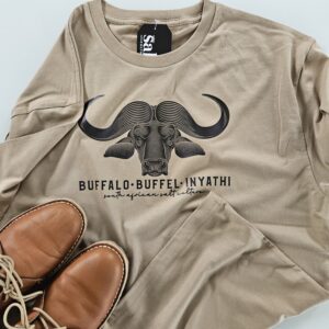 Man wearing South African clothing T-Shirt a sand colour shirt with black Cape Buffalo print